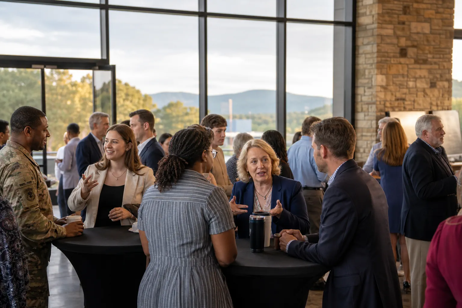 Cross-sector professionals exchanging ideas at a Huntsville community gathering